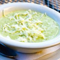 Poblano Soup · Diced chicken fajita meat in a roasted creamy poblano soup, topped with Monterey Jack cheese.