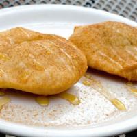 Sopapillas  · Warm, crisp bread puffs dusted with cinnamon sugar and covered in honey.