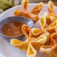 Crab Rangoon · Fried wonton wrapper filled with imitation crab and cream cheese.