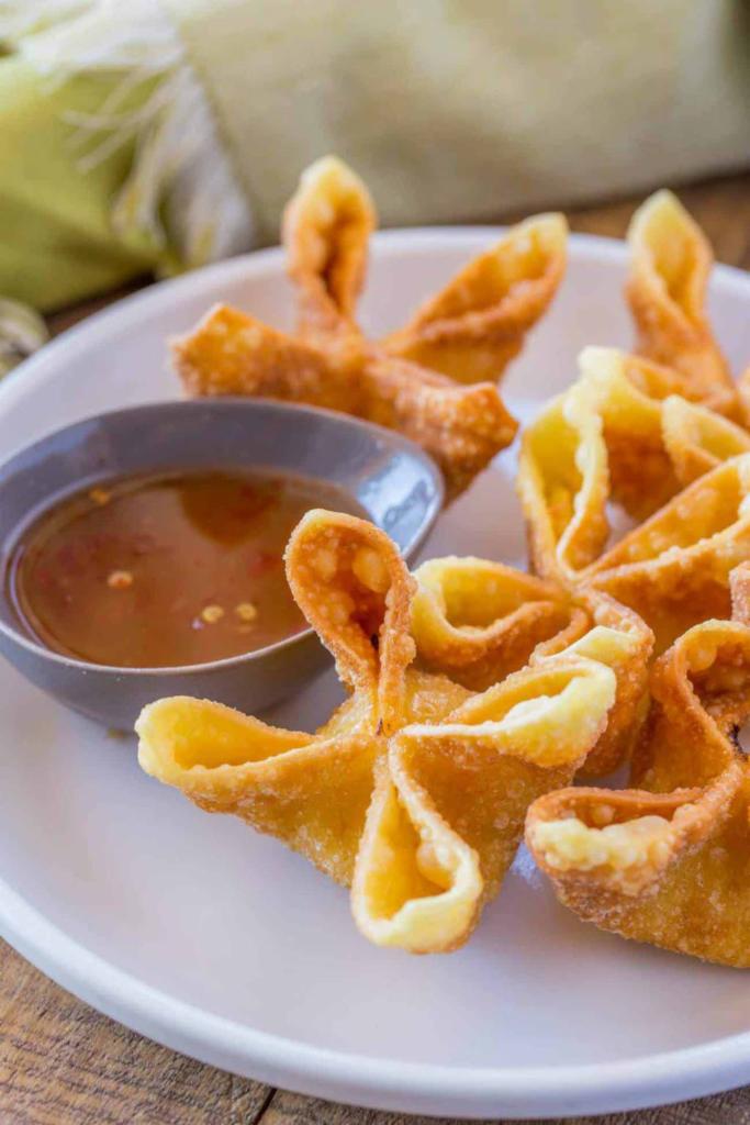 Crab Rangoon · Fried wonton wrapper filled with imitation crab and cream cheese.