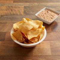 Spicy Bean Dip · A great blend of refried beans, chile verde sauce
and cheese served with hot chips for dippi...