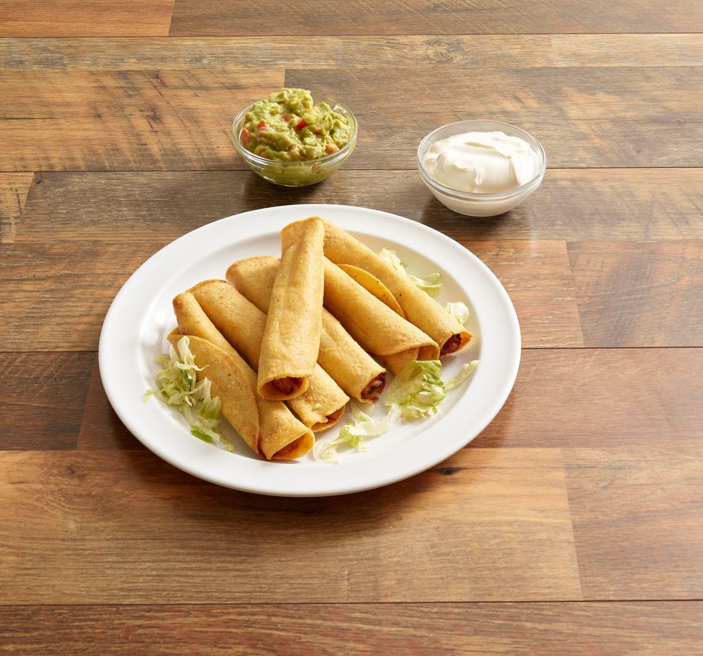 Taquitos · Corn tortillas with chicken or shredded beef
deep-fried for a crunchy taste. Served with
guacamole and sour cream.