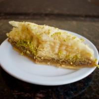 Baklawa · A rich and sweet pastry made with layers of filo dough filled with chopped walnuts and toppe...