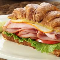Ham Sandwich · Thin sliced ham piled high on our house baked roll with your choice of toppings.