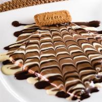 Lotus Crepe · Crepe stuffed with lotus butter and drizzled with Belgian milk, dark and white chocolate and...