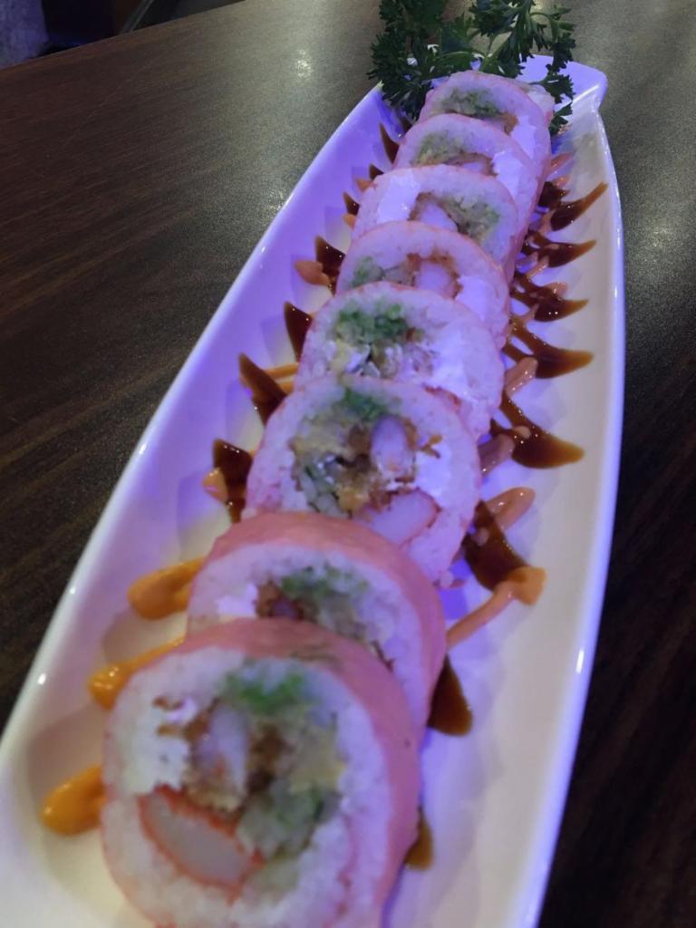 4. Pink Lady Roll · Shrimp tempura, crabmeat, cucumber, avocado, cream cheese, and masago, wrap in soy bean paper, topped with spicy mayo and eel sauce.