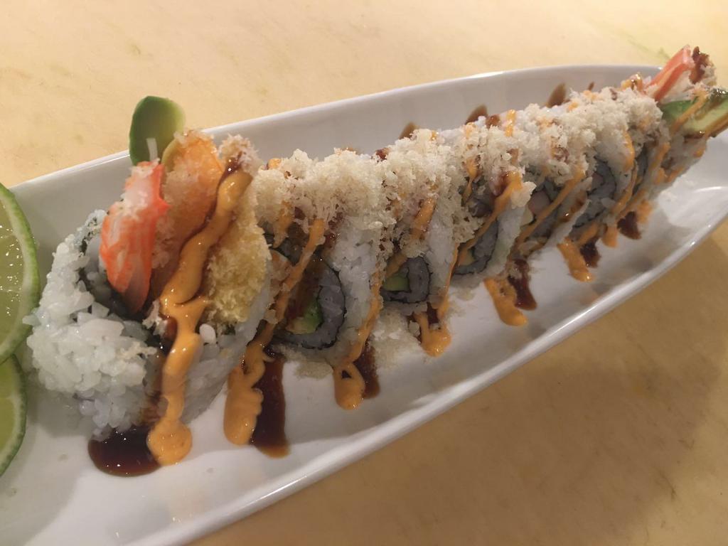 7. Godzilla Roll · Shrimp tempura, cream cheese, spicy crabmeat, avocado, topped with tempura crunch, eel sauce and spicy mayo.