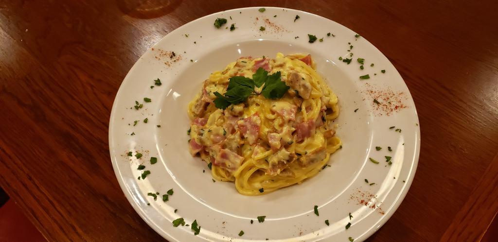 Spaghetti Carbonara · Italian sausage, prosciutto, roasted garlic, Romano Cheese and whole egg sauteed in a cream sauce with spaghetti pasta.