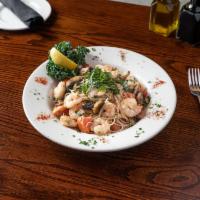 Shrimp Scampi · Shrimp and mushrooms sauteed in roasted garlic and tossed with a white wine sauce basil and ...