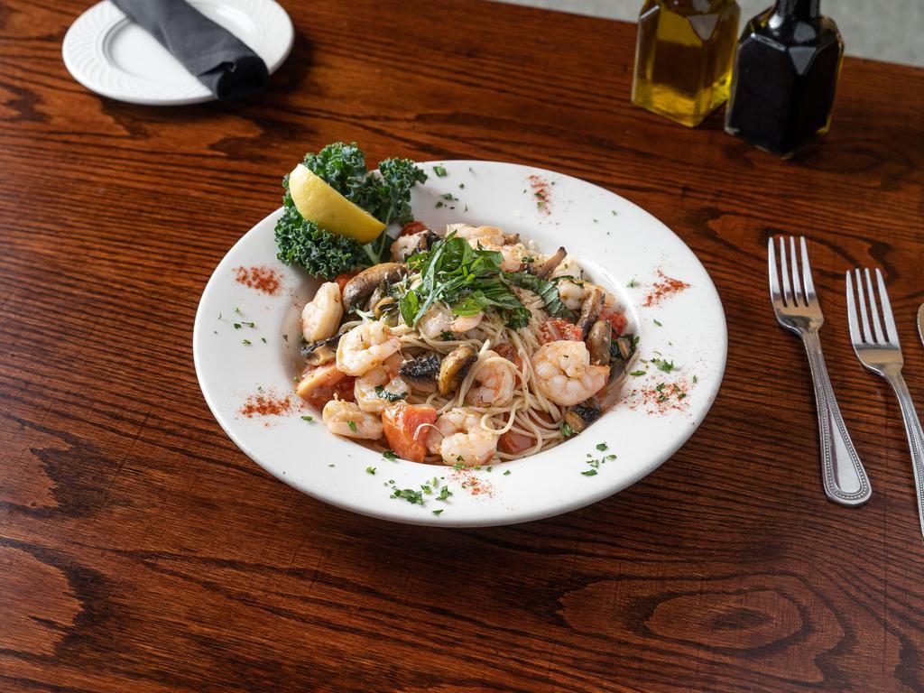 Shrimp Scampi · Shrimp and mushrooms sauteed in roasted garlic and tossed with a white wine sauce basil and Roma tomatoes over angel hair pasta.