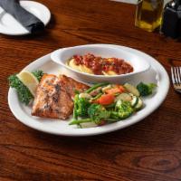 Grilled Alaskan Salmon · 8 oz. filet of salmon grilled in lemon and butter, garnished with parsley. Served with saute...