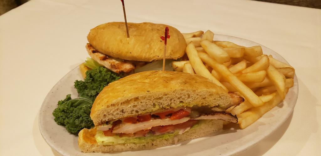Italian Chicken Sandwich · Broiled breast of chicken topped with provolone. Served on french bread with roasted red peppers and your choice of marinara or pesto aioli.