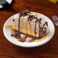 Mud Pie · Cappucino Chip Ice Cream, Vanilla Ice Cream separated by a layer of Roasted walnues and Cara...