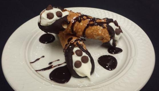 Cannoli · Italian Pastry filled with sweet cream and ricotta cheese with dark chocolate accents