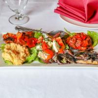 Antipasto Arrosto · Hummus, cabonada, roasted portobello, roasted peppers, tomato and mozzarella salad on a bed ...