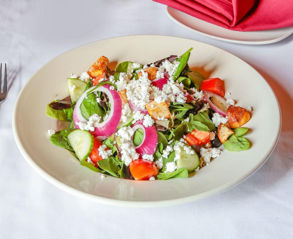 Greek Salad · Spring mix with olives, tomatoes, cucumber, onions, feta cheese, croutons and house dressing.