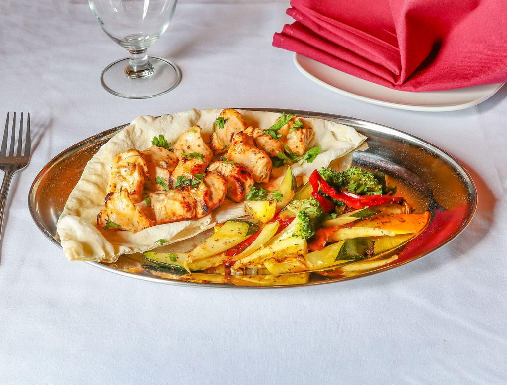 Chicken Kebab · White meat. Served with salad, lavash and choice of side.