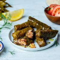 Dolmades · Six Stuffed Grape Leaves with Rice, Lemon Juice, and Fresh Herbs. Served Chilled