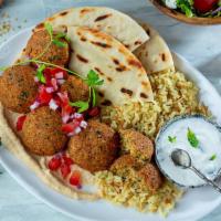 Falafel Plate · Falafel Served with Mint Yogurt, Side Salad, and Pita Bread Plus Your Choice of Rice Pilaf, ...
