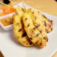 Chicken Satay · Grilled marinated chicken on 4 skewers served with peanut sauce and cucumber vinaigrette.