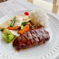 Grilled Teriyaki Sirloin · Sirloin steak grilled to perfection brushed with teriyaki sauce. Served with vegetables & wh...