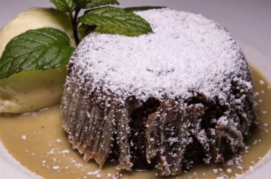 Chocolate Lava Cake · Slrawberrv compote, whipped cream and chocolate pearls.