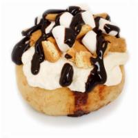 *Campfire S’mores Roll · marshmallow frosting topped with marshmallows, graham cookies and chocolate sauce