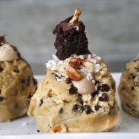 Cookie Dough Scoop - German Chocolate · our homemade cookie dough topped with a dollop of chocolate frosting, a brownie bite morsel,...