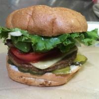 Bacon Cheeseburger · Housemade burger patty with tempeh bacon, vegan cheese, lettuce, tomato, onion, pickles, ket...