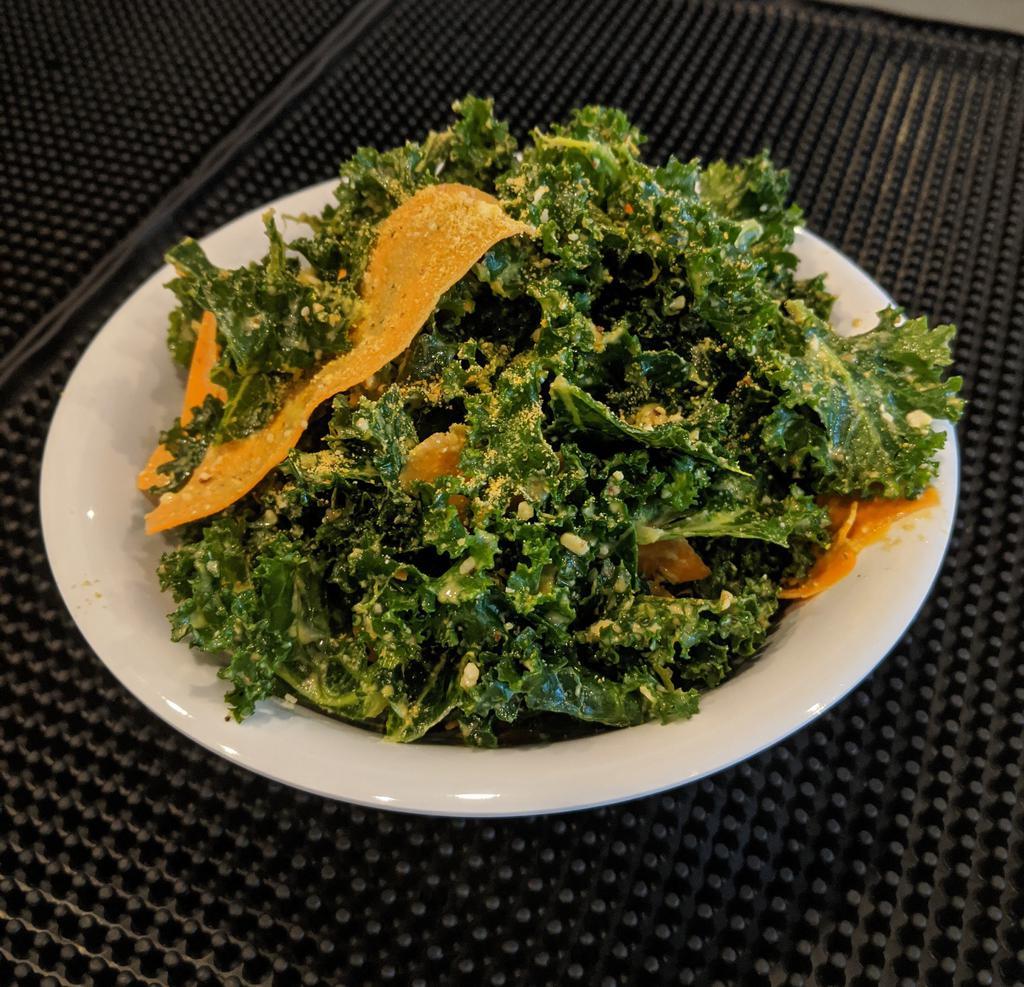 Kale Salad · Massaged kale with Italian dressing, carrots, almond Parmesan.