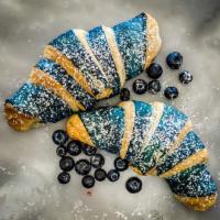Vegan Blueberry Croissant · Filled with a blueberry compote and wrapped in a thin layer of blueberry dough, enjoy a brig...
