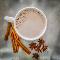 Chai Tea · Black tea stepped with a blend of ginger, cardamom, cinnamon, fennel, black pepper and clove...