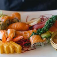 Sushi and Sashimi Combo* · 5 pieces of sushi and sashimi and 1 roll. Served with miso soup and house salad. Chef's choi...