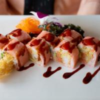 Happy Dragon Roll · Shrimp tempura, cucumber inside, eel avocado on top with spicy mayo and eel sauce.