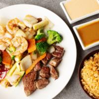 Steak and Shrimp Hibachi Dinner* · Served with clear soup, house salad, vegetables, and your choice steamed or fried rice.