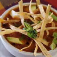 Chicken Tortilla Soup · Chicken, tomatoes, onions, tortilla strips, and panela cheese.