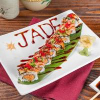 Jade Roll · Spicy salmon, cucumber topped with eel, smoked salmon, scallion and eel sauce.