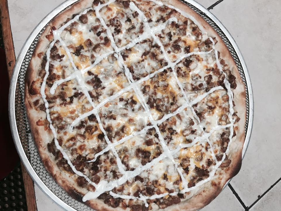 Chicken Bacon Ranch Pizza · 8 slices. Pieces of tender chicken cutlet, mozzarella and American cheese topped with bacon bits and ranch dressing.