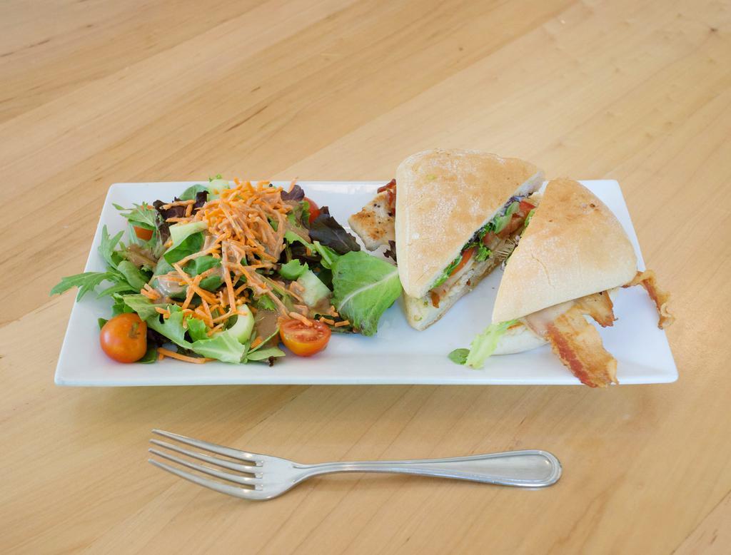 Spicy Chicken · Grilled chicken, bacon, avocado and tomatoes with roasted chipotle mayo and pepper jack. Served with a side salad.