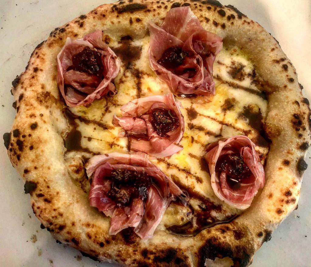Summer Pizza · Mozzarella, French Brie cheese, figs jam, prosciutto di Parma drizzled with fig balsamic vinegar.