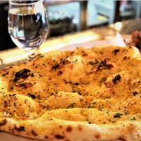 Garlic and Basil Naan · Leavened bread of fine flour flavored with garlic and basil. 