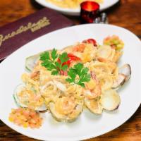 Seafood Linguinne · The ultimate seafood linguine with shrimp, lobster, clams, mussels and calamari.