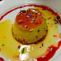 Vanilla Flan · Delicious homemade vanilla flan, rained with a rainbow of sprinkles and garnished with straw...