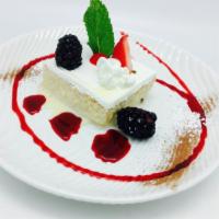 Tres Leches Cake · Wet cake and milk. With strawberry syrup.