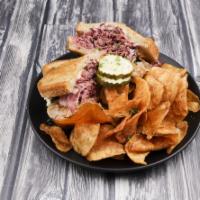 Paddy's Famous Reuben · Thinly sliced, cooked in-house corned beef, melted Swiss cheese, sauerkraut, topped with hom...