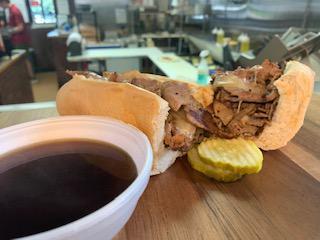 French Dip · Beef, Swiss cheese and grilled onions served with a side of Au jus.
