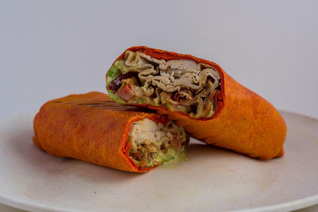 Chicken Chipotle Wrap · Grilled chicken, hot pepper cheese, grilled onions, lettuce, tomato and chipotle sauce for dipping.