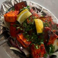 37. Tandoori Paneer Tikka ·  Fresh home style paneer marinated with spices and cooked with bell pepper and onion on a sk...