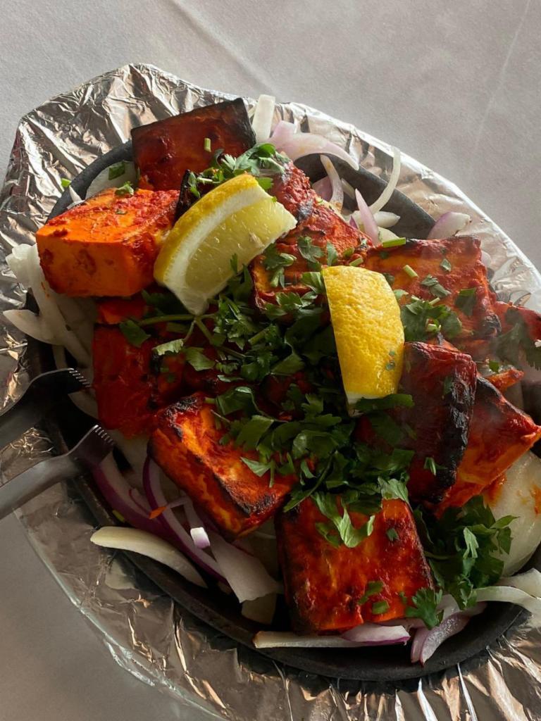 37. Tandoori Paneer Tikka ·  Fresh home style paneer marinated with spices and cooked with bell pepper and onion on a skewer.