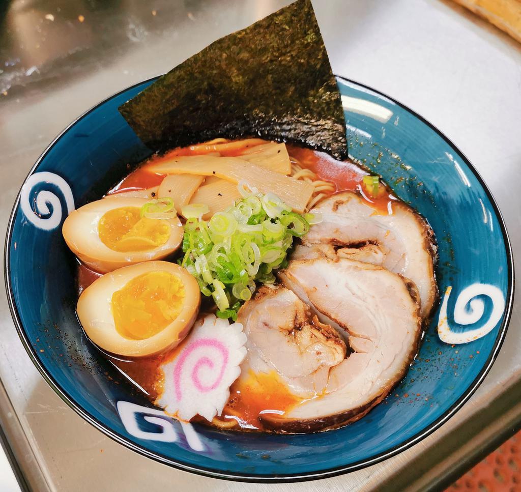 Killer Ramen · Tonkotsu pork broth, in straight noodles with soft boiled egg, homemade roast pork, menma, green onion, seaweed chips, with spicy sauce.